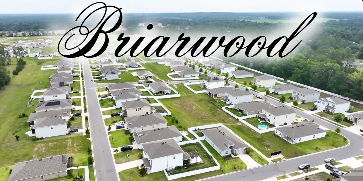 Briarwood Alachua aerial view of homes, green lawns in new construction community -  move in ready