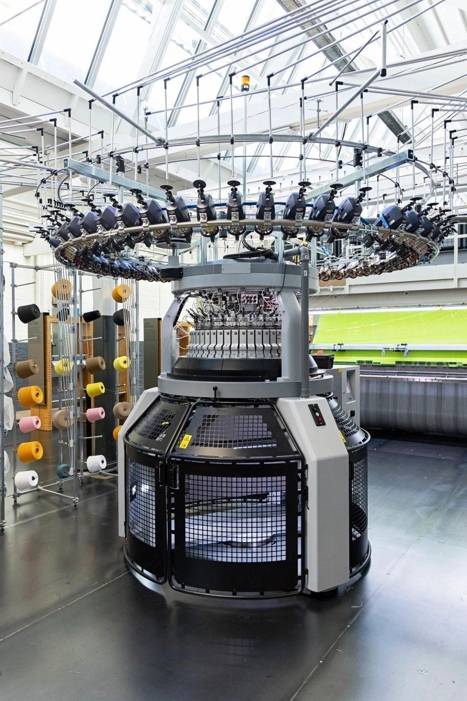 A modern circular knitting machine in a bright textile factory. We manufacture in high quality German made machinery with quality assurance.