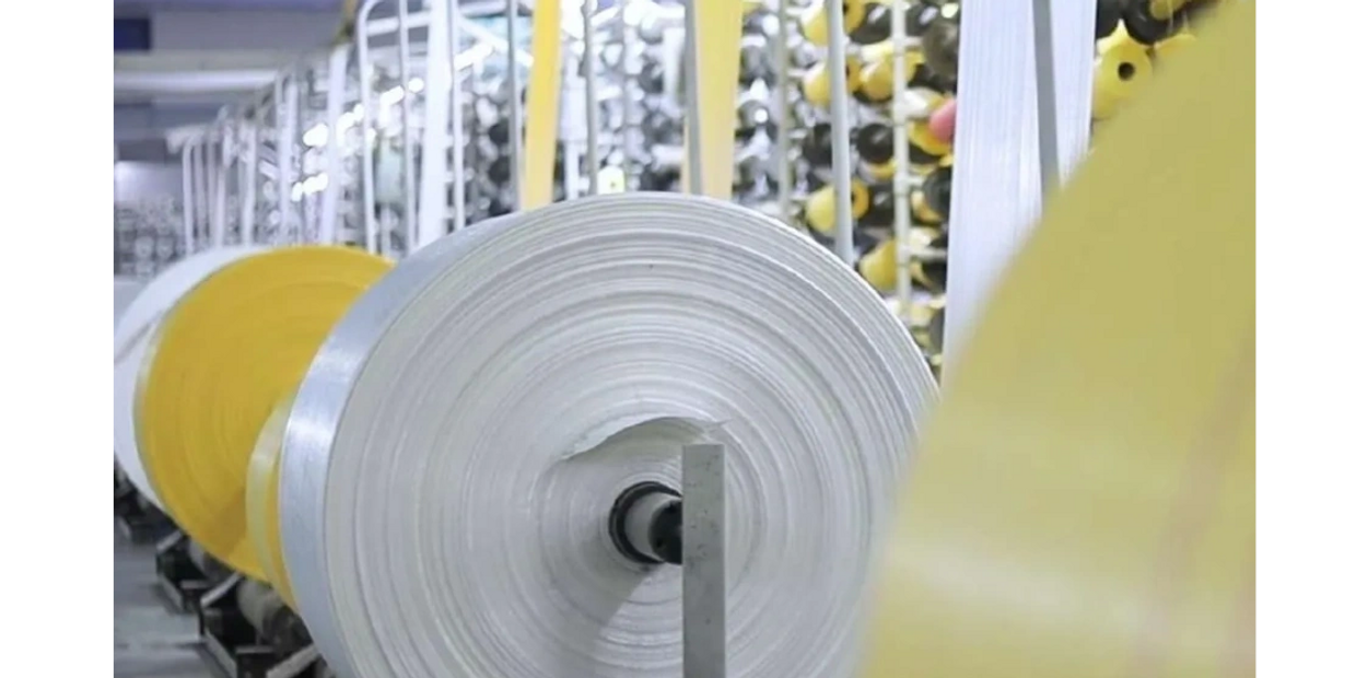 Large rolls of fabric or material in a textile factory.