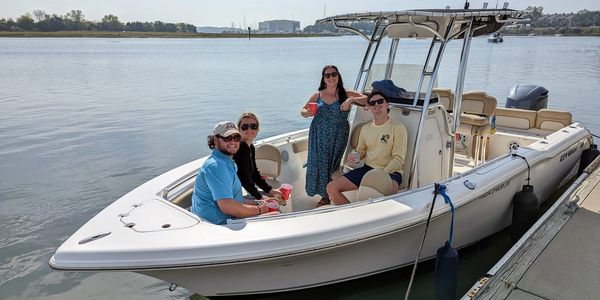 Here's our 24' center console. It is roomy and handles larger groups with cargo with ease. 300 HP!