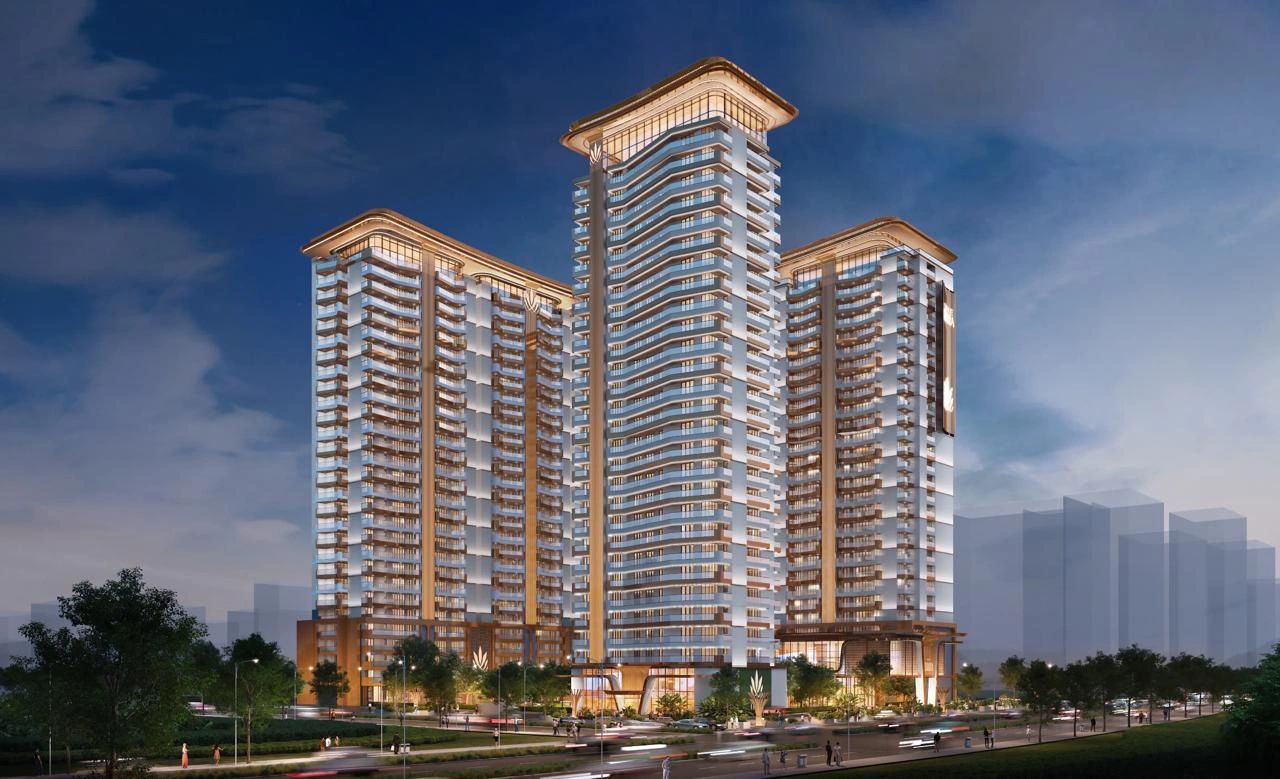 Modern illuminated high-rise residential buildings at dusk.