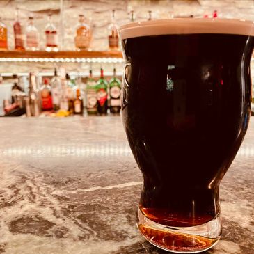 Dark stout beer on a bar counter.