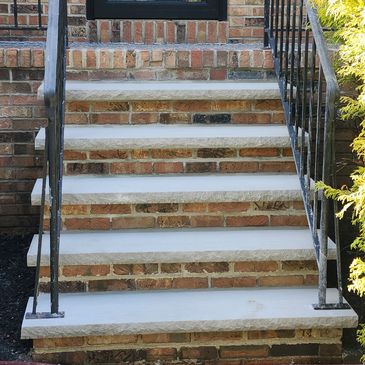 Custom restoration of old crumbling brick steps to new limestone steps 
