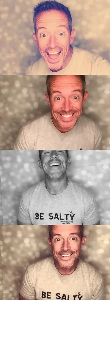 Handsome middle age man smiling in Photobooth looking for wedding inspo