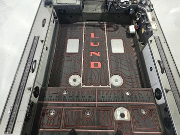 Interior of a Lund fishing boat with custom flooring.