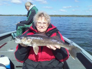 Happy fisher old woman