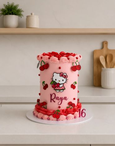 Pink Hello Kitty birthday cake with cherries and name Raya.