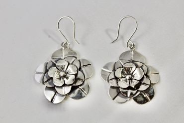 Silver flower-shaped earrings.
