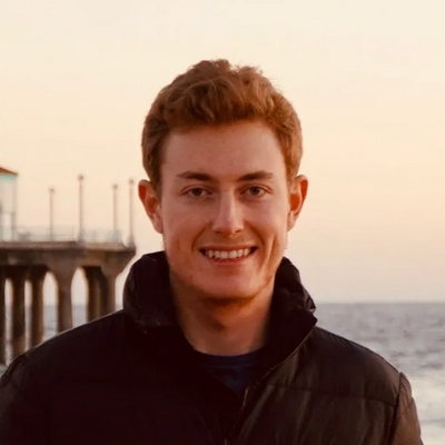 Alex Wiberg, TPI's Project Engineer smiles at the beach.