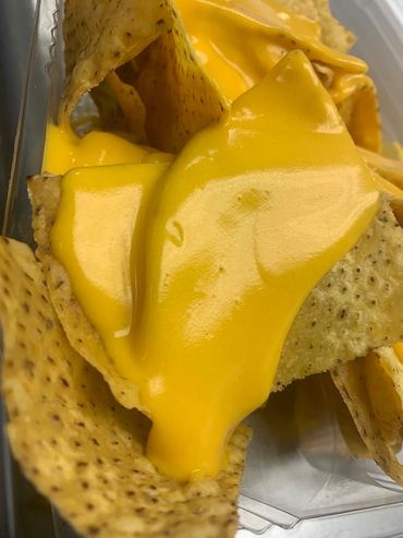 Alt="Nachos and cheese from MooSa's"