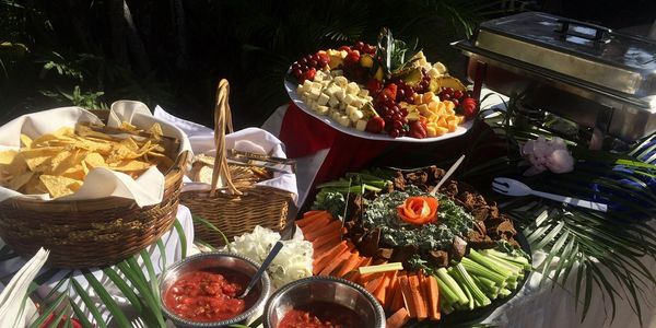 Buffet with cheese platter and spinach dip