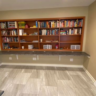 Craft room storage shelving by Closet Concepts.