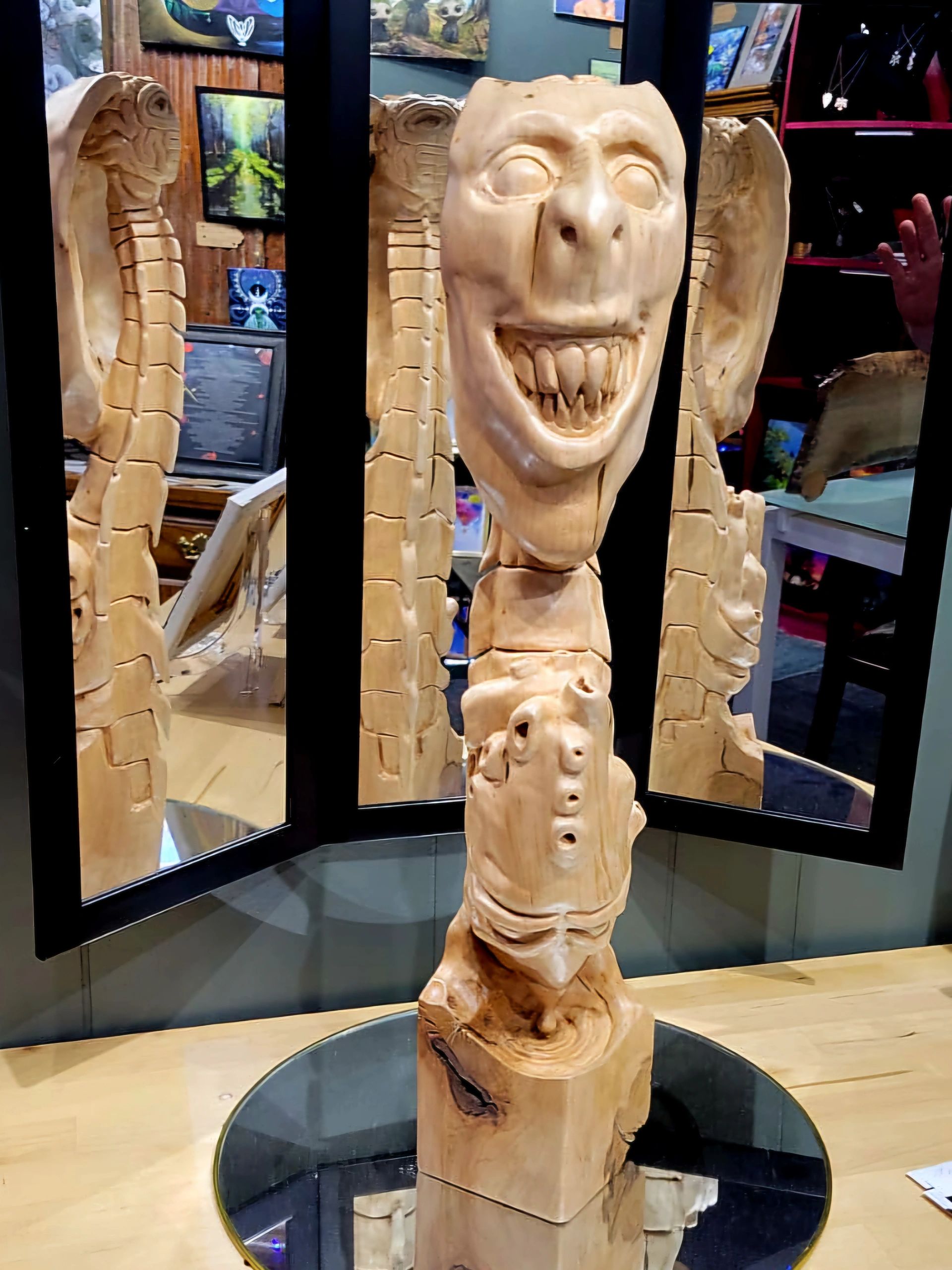 sculpture by artist Chad Rev Art depicts a creepy face, toothy smile, heart, spine and brain