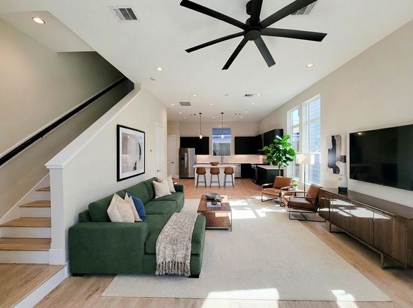 Virtually staged living space beside a staircase with coordinated furniture and decor