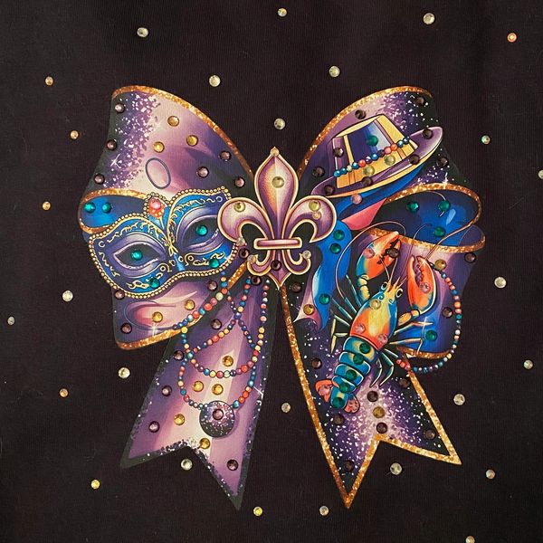 100% Long sleeve black Gildan tee.  Majestic purple bow with a Fleur de Lis center and everything Lo