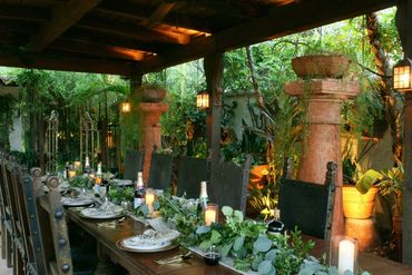 covered palapa with table set for an event