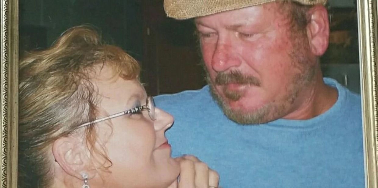 A woman lovingly gazes up at a man in a close, tender moment.