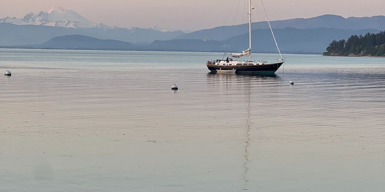 Utsalady bay with Sailboat and Mount Baker in Distance
