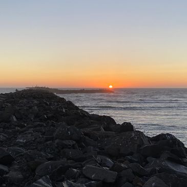 A sun setting into the ocean