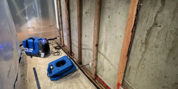Animikii Restorations - Structural Drying from a foundation leak.