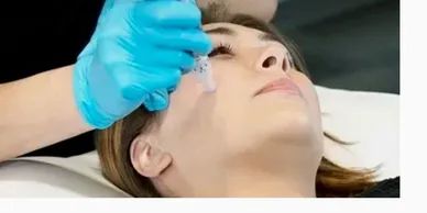 A girl getting face treatment in a hospital