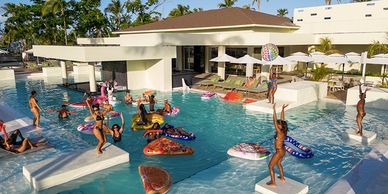 people having fun in a pool in the Caribbean