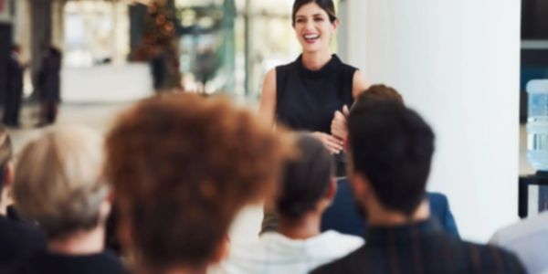 Woman facilitating a training session. 