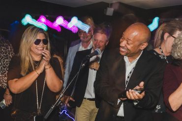 People enjoying a lively party with music and laughter.