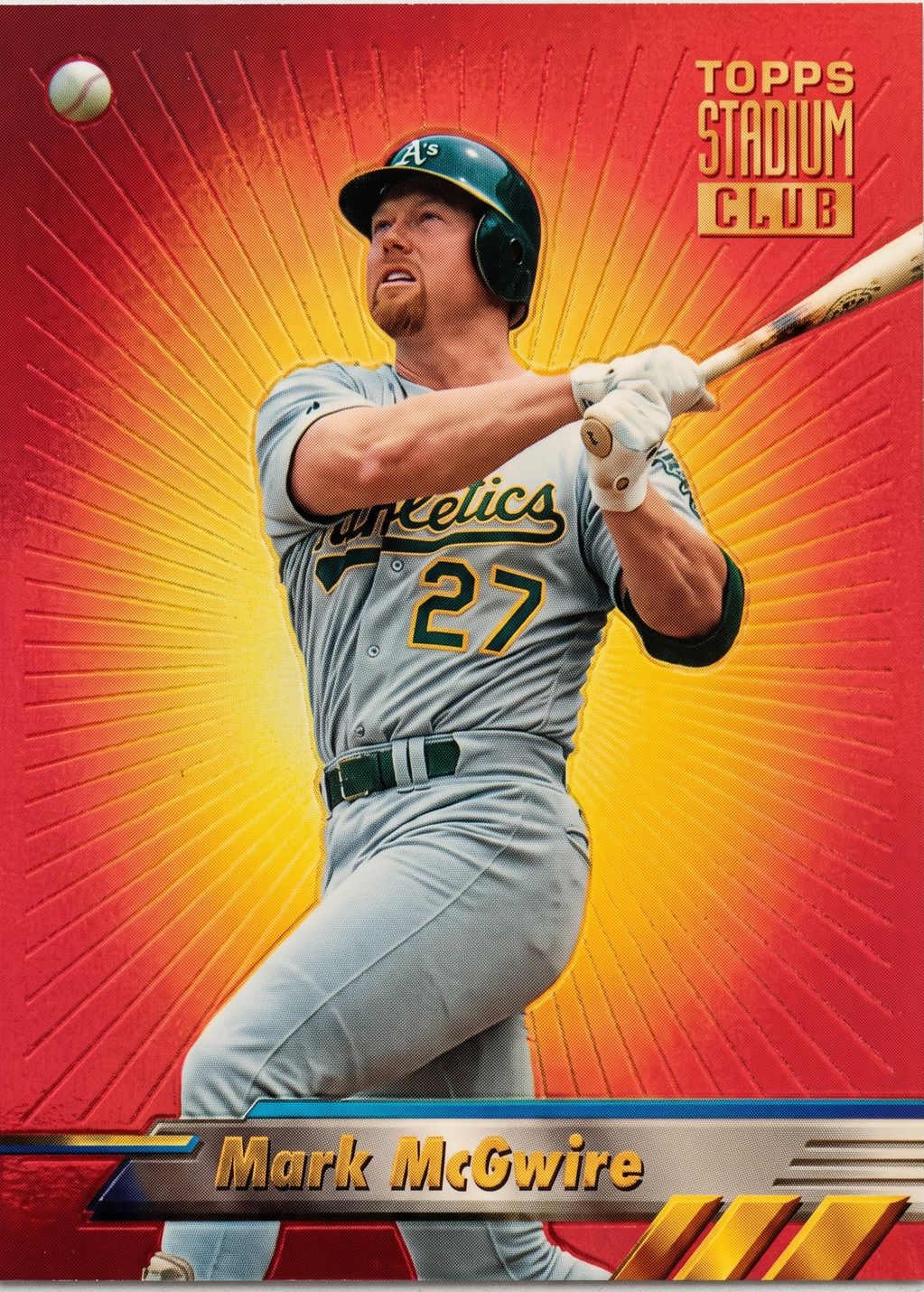 Baseball card of Mark McGwire swinging a bat.