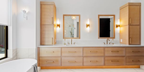 A bright and modern bathroom with sleek finishes and custom tilework.