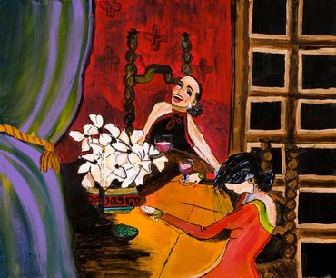 Two women drinking at table.