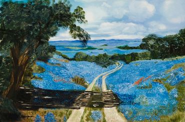 Winding road through blue flowers.