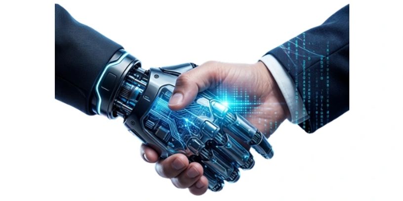 Human hand shaking a robotic hand.