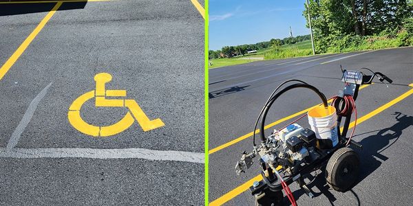 Parking lot with freshly painted handicapped symbol and painting machine.