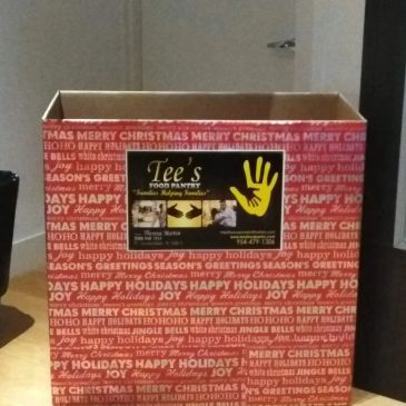 Empty holiday-themed donation box from Tee's Food Pantry.