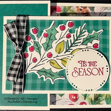 Festive holiday card with holly, berries, and a plaid ribbon.