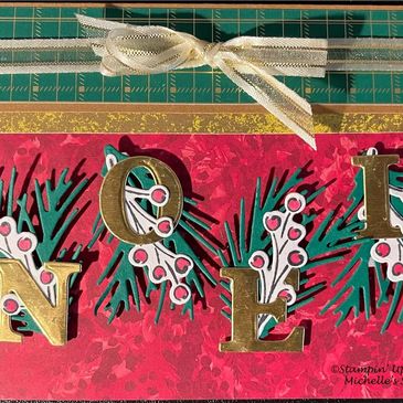 Holiday-themed card spelling 'NOEL' with decorative greenery and berries.
