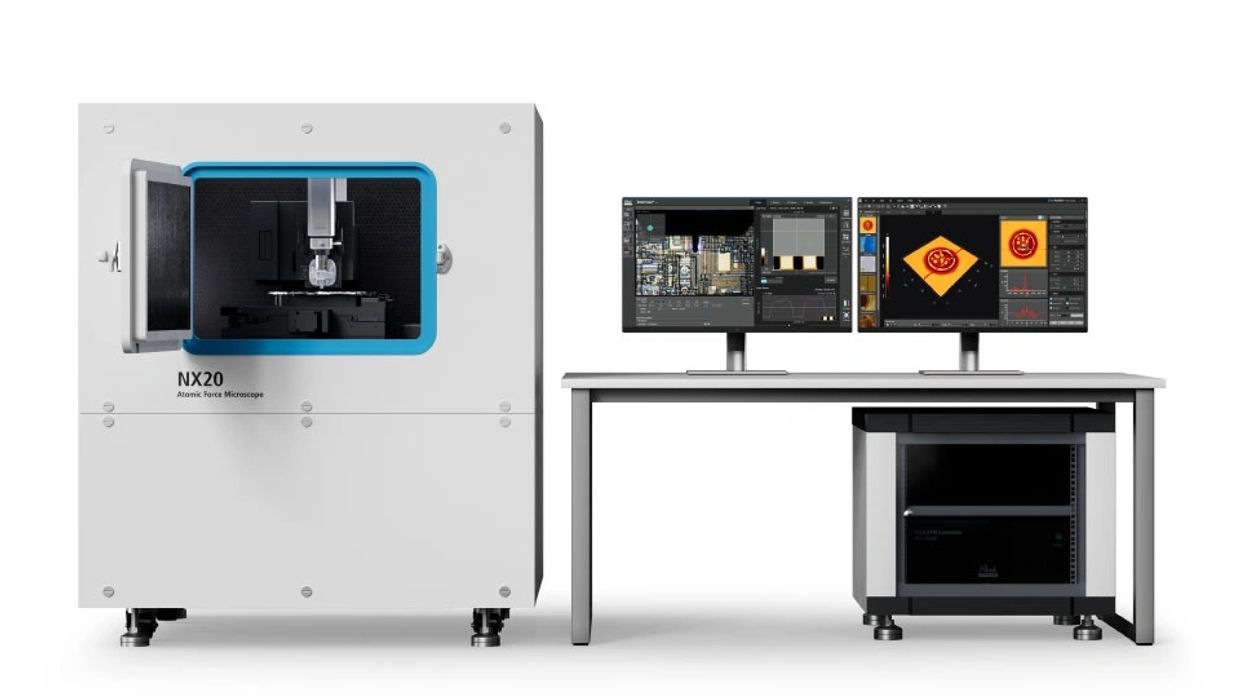 NX20 Atomic Force Microscope system with two monitors and control unit on a desk.