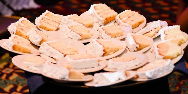 The cake cutting, with uniformed sliced cakes.