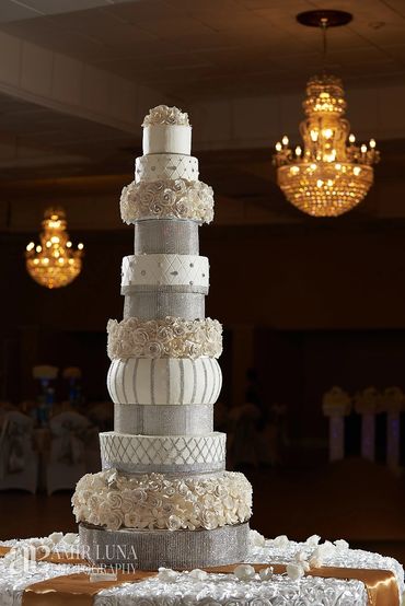 Rhinestone, sugar flowers and delicious cake, makes this design a show stopper wedding cake.