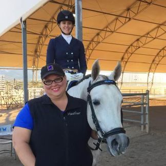 Lesson instructor Heather of Dynamite Riding Academy with a student rider & horse at Westworld show.