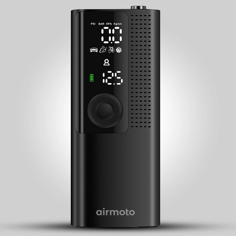 Compact black digital air compressor with display and control button.