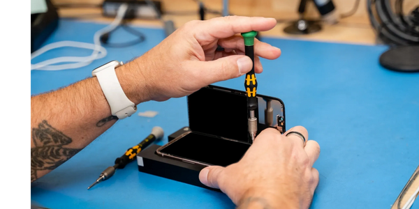 A person repairing a mobile phone