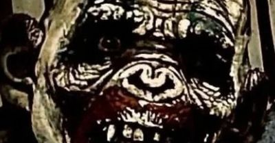 Creepy painted face with dark, eerie features.