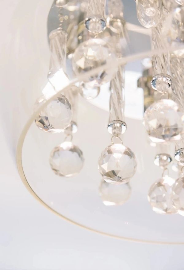 Close-up of a crystal chandelier with hanging faceted glass balls.
