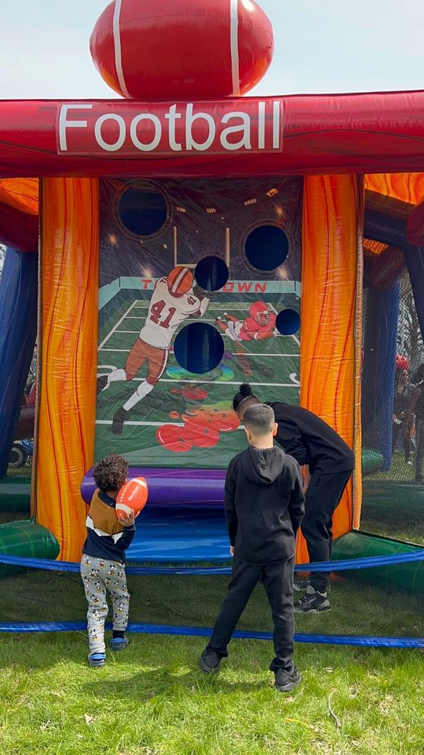 kids playing blow up football games