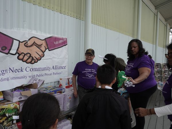 Angela handing out gifts to children 