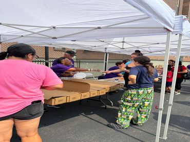 Volunteers handing out produce