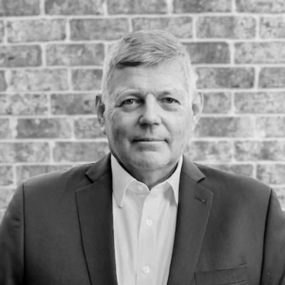 Portrait of a middle-aged man in a suit.