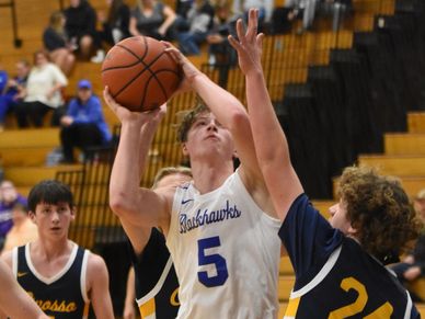 Stefan Austin playing varsity basketball 
